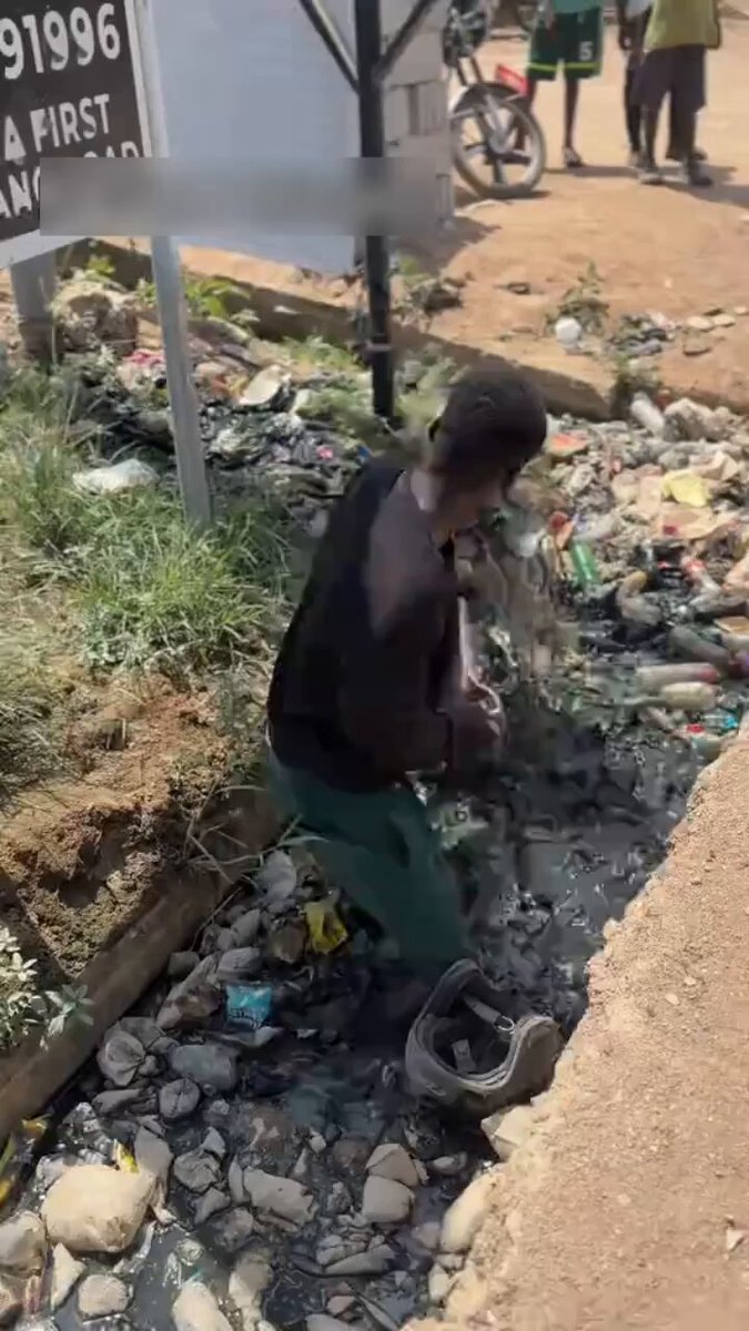 Residents Punish Suspected Thief by Cleaning Gutters in Kasoa